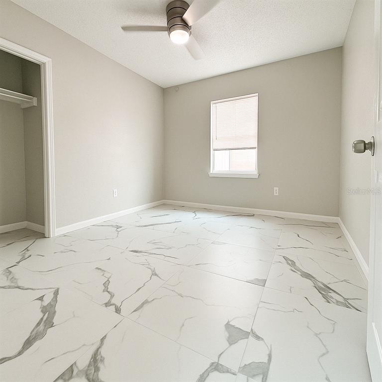 3208 Timberline Road Winter Haven, FL 33880 - Photo 13 of 21 a view of an empty room and window