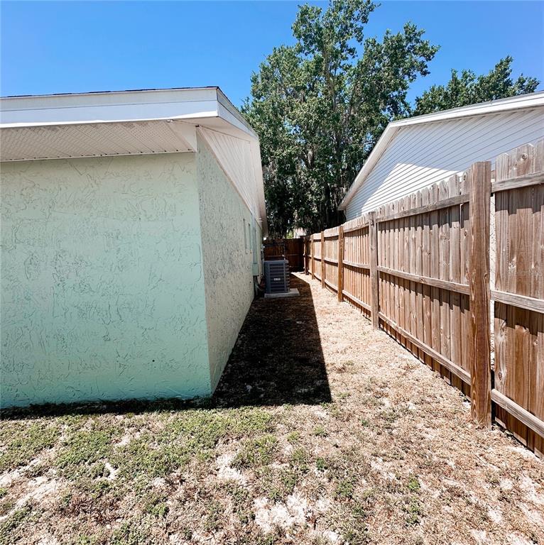 3208 Timberline Road Winter Haven, FL 33880 - Photo 15 of 21 a view of balcony with wooden floor and fence