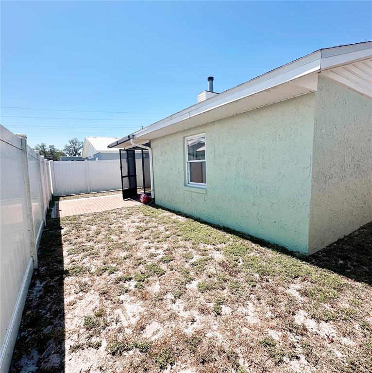 3208 Timberline Road Winter Haven, FL 33880 - Photo 20 of 21 a view of a backyard of a house