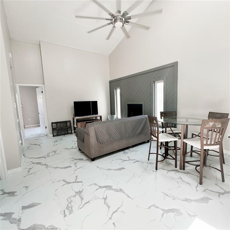 3208 Timberline Road Winter Haven, FL 33880 - Photo 8 of 21 a living room with furniture and a flat screen tv