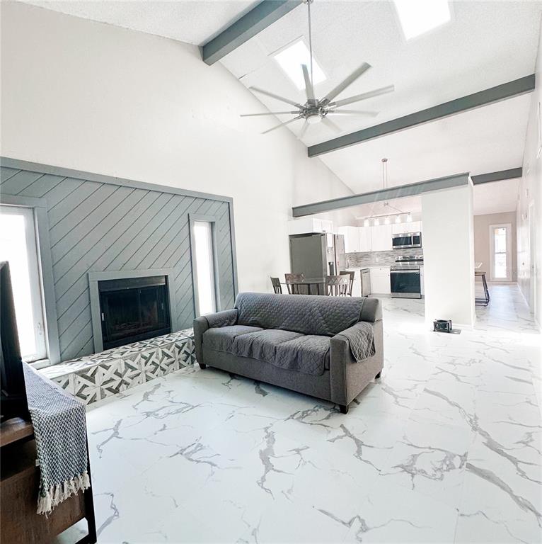 3208 Timberline Road Winter Haven, FL 33880 - Photo 9 of 21 a living room with furniture and a fireplace