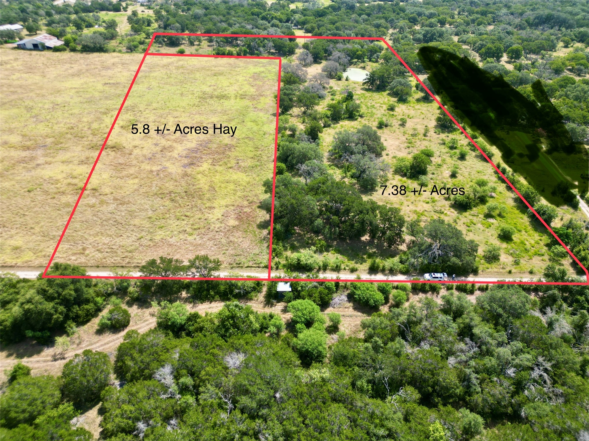 200/ Shady Grove Road Bertram, TX 78605 - Photo 1 of 17 An aerial perspective reveals generous acreage featuring both cultivated land and natural tree coverage.