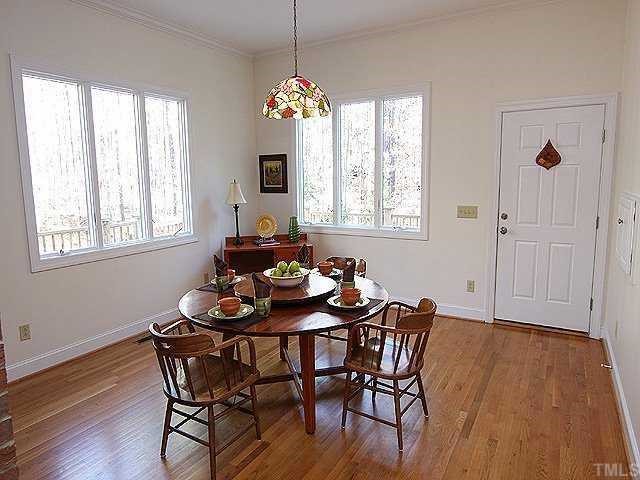 645 Neodak Road Apex, NC 27523 - Photo 5 of 12 Adjacent to living area with easy access to deck and screened porch