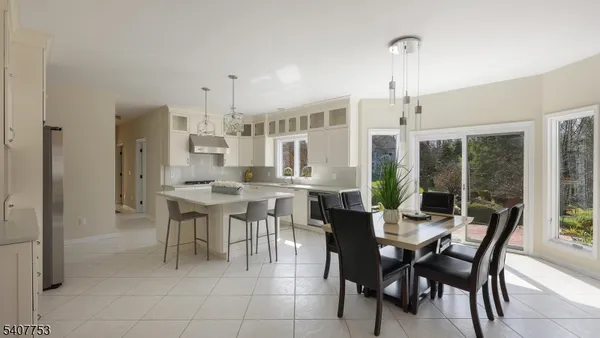 a view of a workspace with furniture and a potted plant