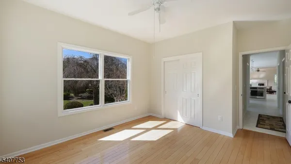 a bathroom with a double vanity sink a toilet and a mirror