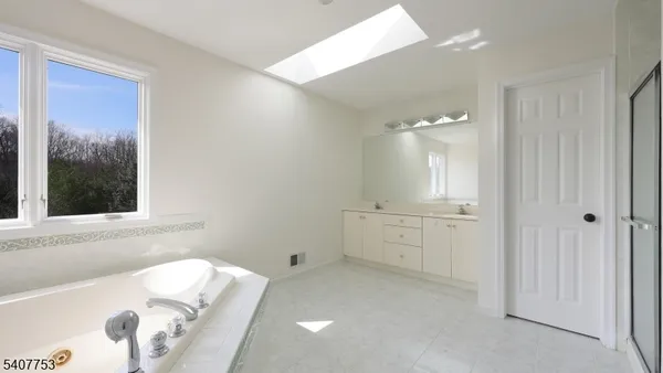 a room with furniture pool table and a flat screen tv