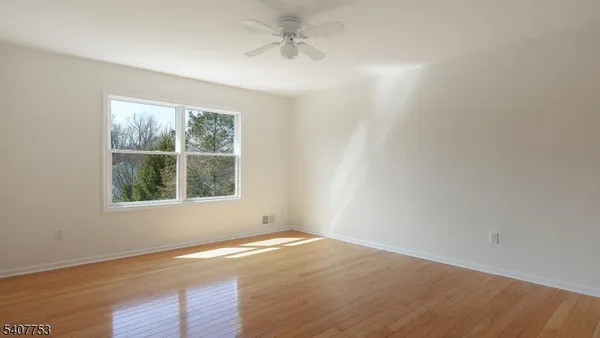 a bathroom with a sink toilet and mirror