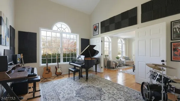 a view of a dining room with furniture and chandelier