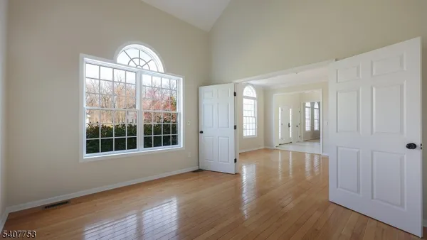 a view of a dining room with furniture and chandelier