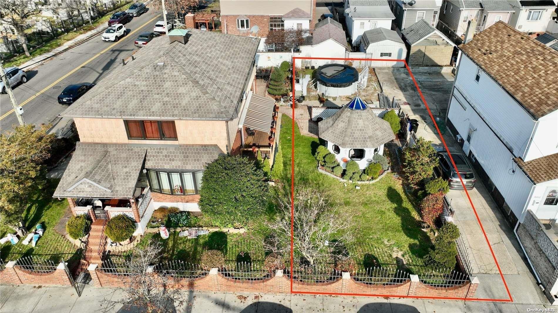 84-07 Sutter Avenue Queens, NY 11417 - Photo 2 of 7 an aerial view of houses with outdoor space