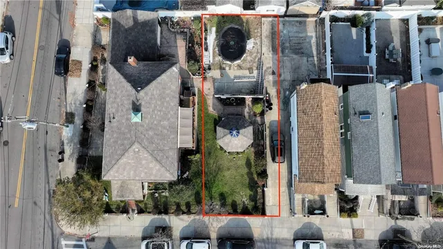 an aerial view of houses with outdoor space