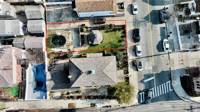 an aerial view of a house with yard