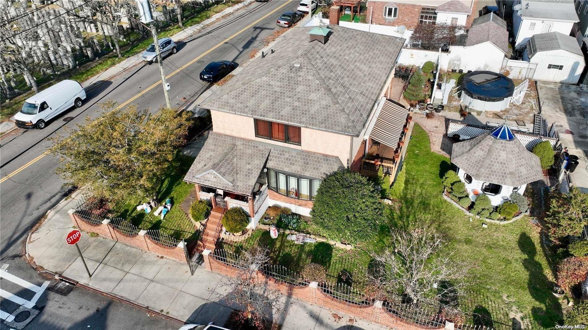 84-07 Sutter Avenue Queens, NY 11417 - Photo 6 of 7 an aerial view of a house with yard