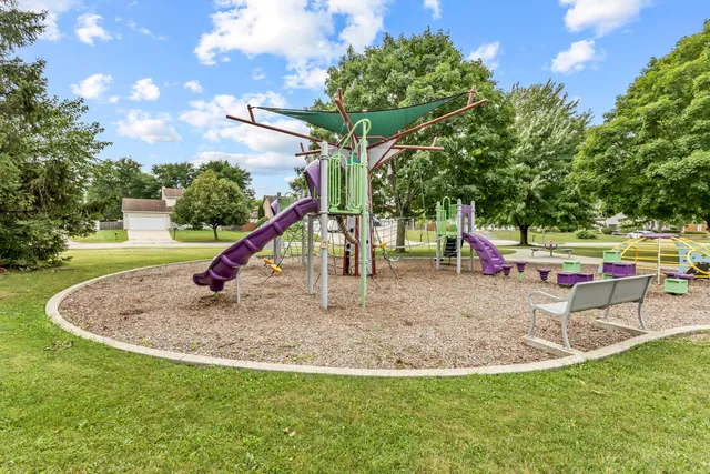 a view of a park with swings