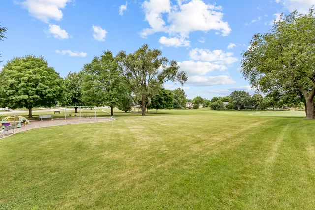 a view of outdoor space with garden and trees