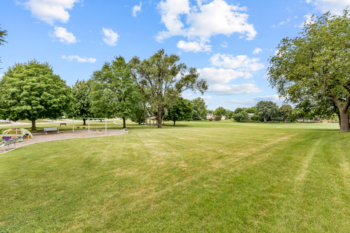 8 Gant Circle, Unit A Streamwood, IL 60107 - Photo 18 of 20 a view of outdoor space with garden and trees