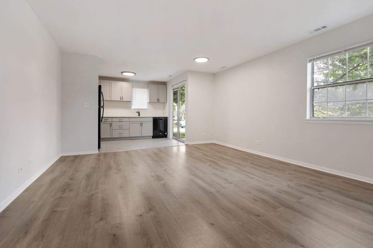 8 Gant Circle, Unit A Streamwood, IL 60107 - Photo 2 of 20 wooden floor in an empty room with a window