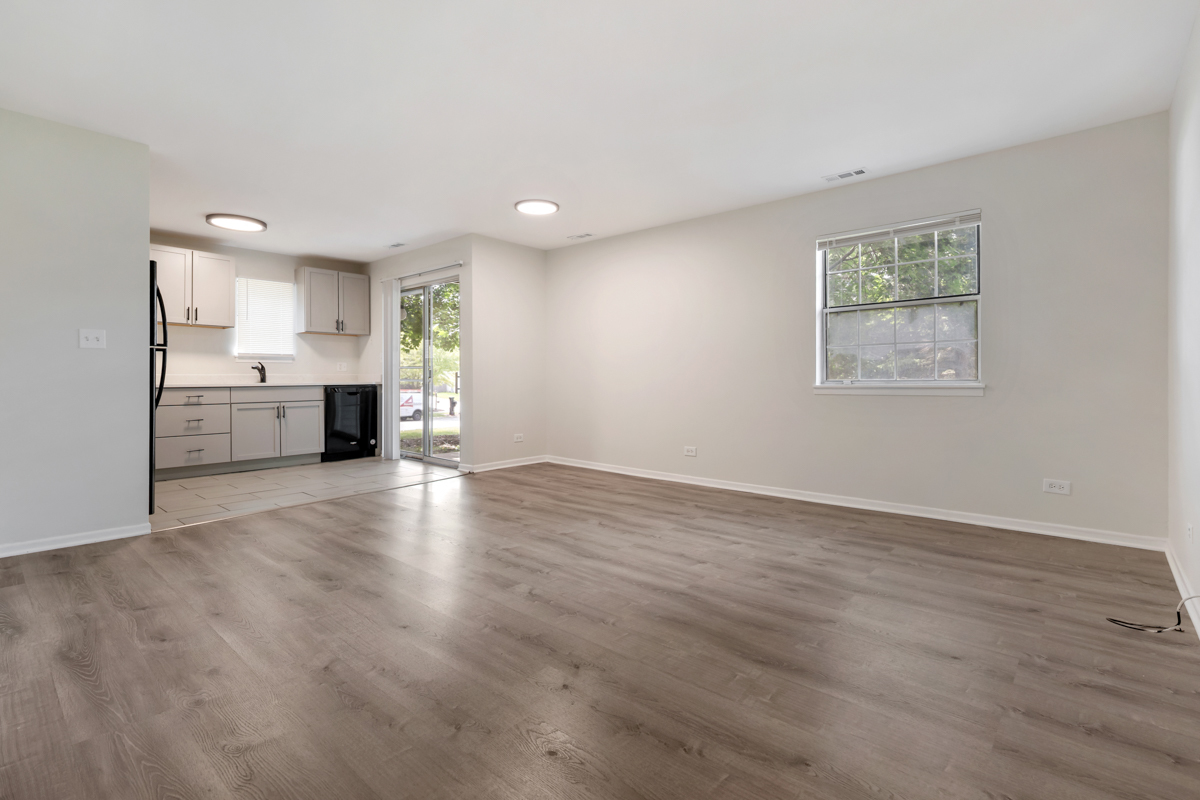 8 Gant Circle, Unit A Streamwood, IL 60107 - Photo 3 of 20 a view of empty room with kitchen and window
