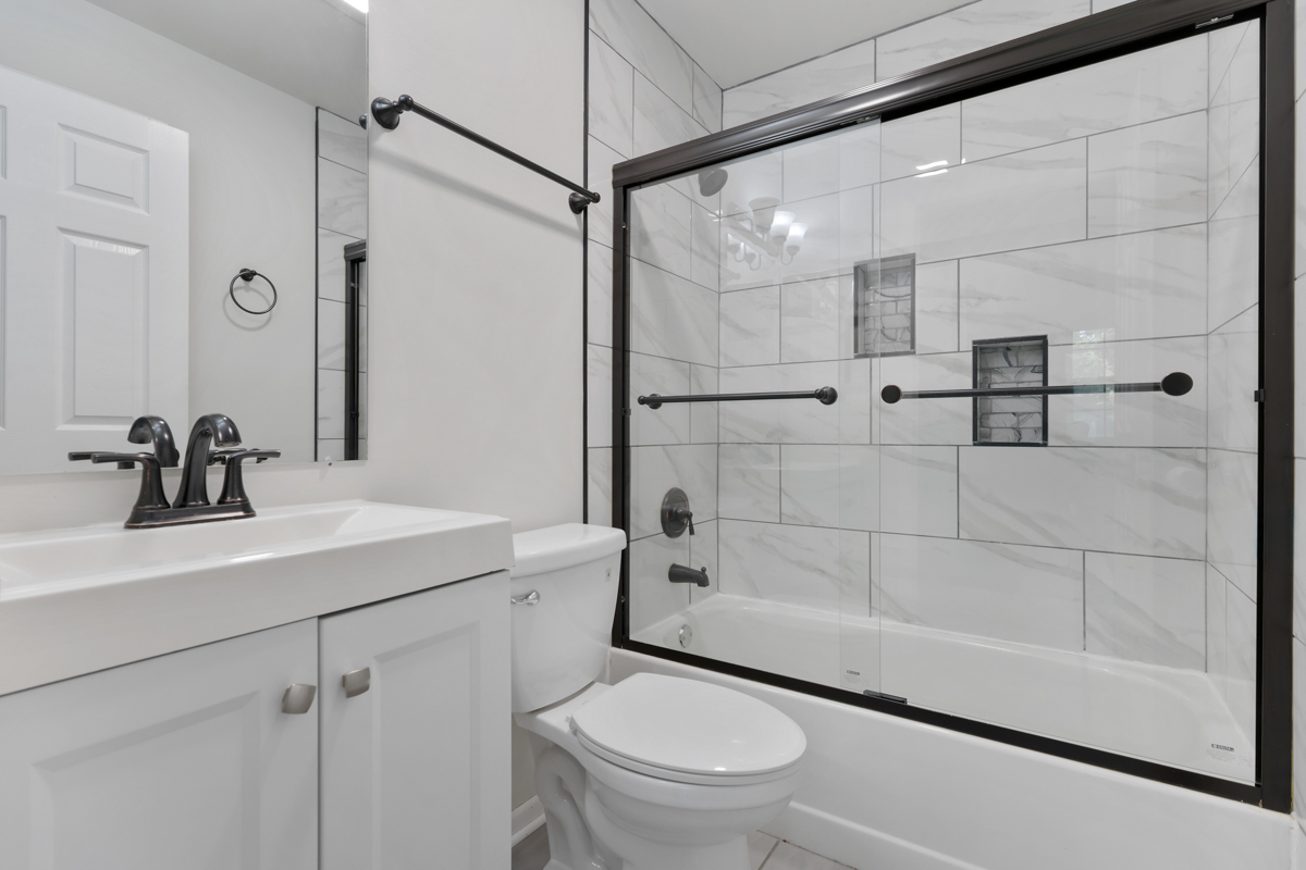 8 Gant Circle, Unit A Streamwood, IL 60107 - Photo 10 of 20 a bathroom with a sink a toilet and shower
