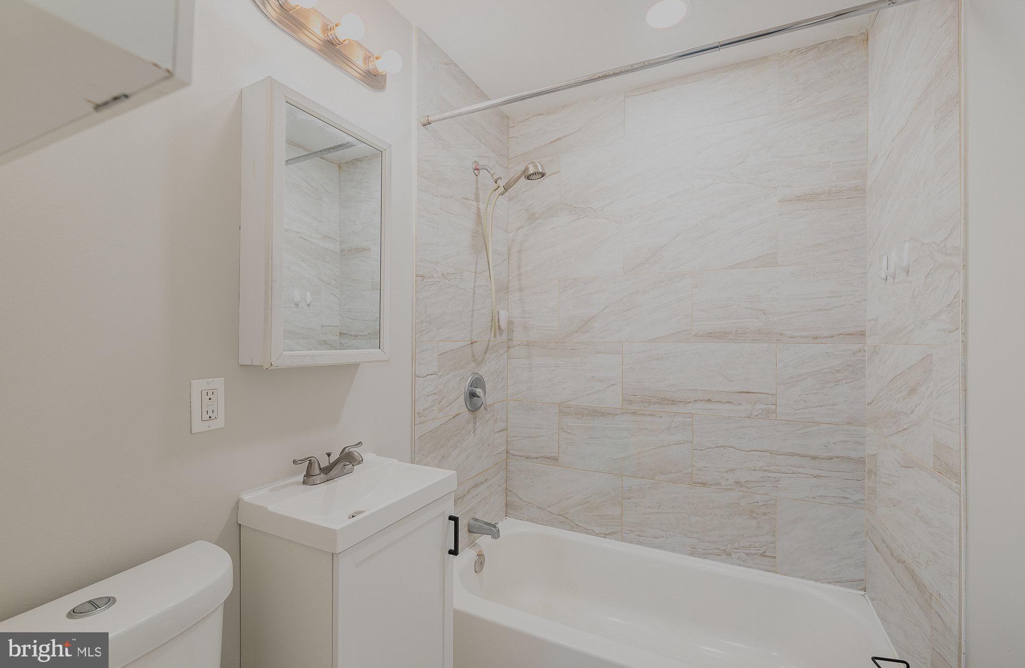 3402 Cornwall Road Dundalk, MD 21222 - Photo 22 of 25 a bathroom with a sink a toilet and shower