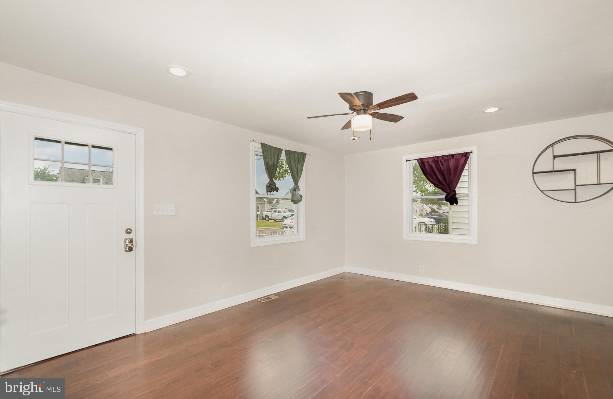 3402 Cornwall Road Dundalk, MD 21222 - Photo 4 of 25 an empty room with window and ceiling fan