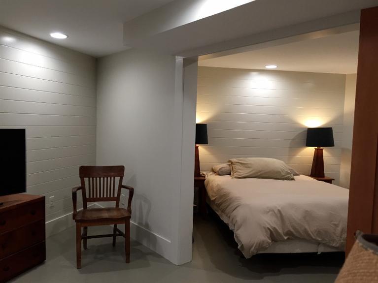 14 Sky View Drive Truro, MA 02666 - Photo 15 of 19 a bedroom with a bed chair and a lamp on desk