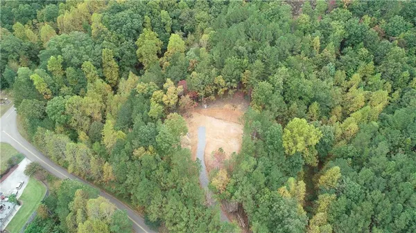 a view of a lake with a yard