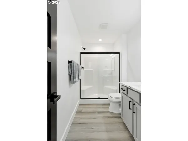 a view of a bathroom with a sink and a mirror
