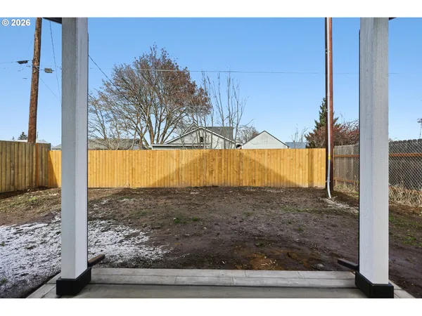 a view of a backyard of the house