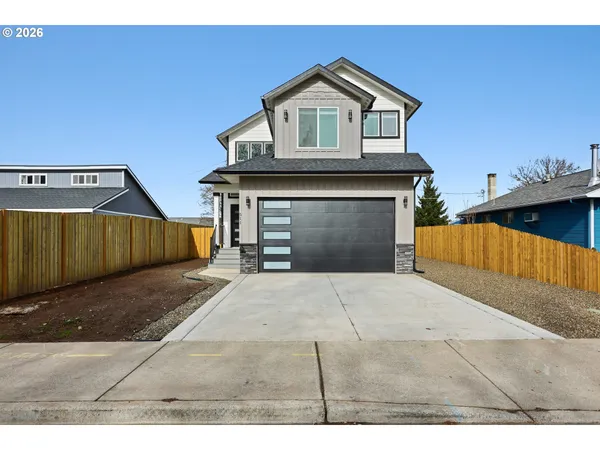 a front view of a house with a garage