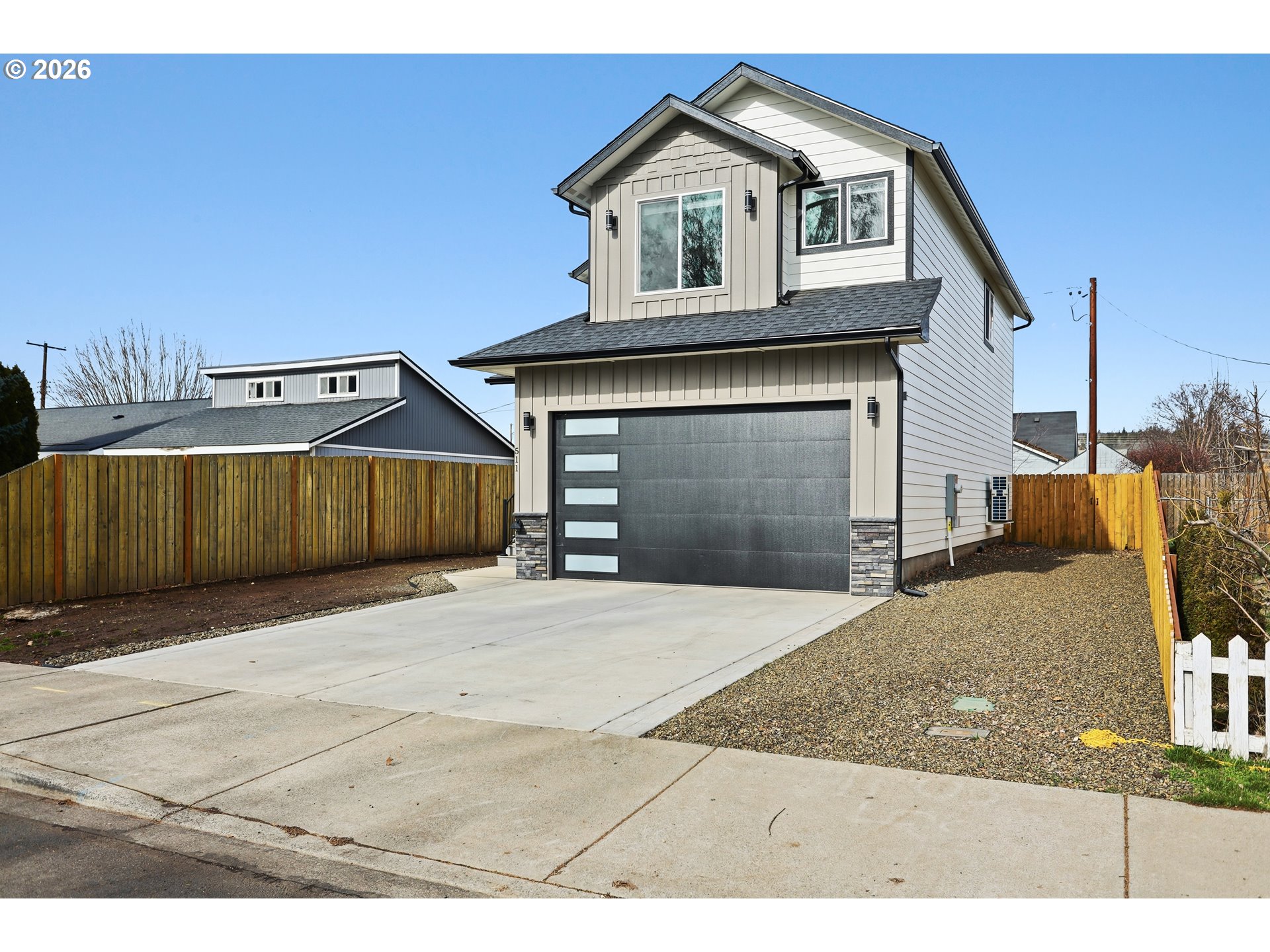 511 East Collins Street Goldendale, WA 98620 - Photo 39 of 41 a front view of a house with a yard and garage