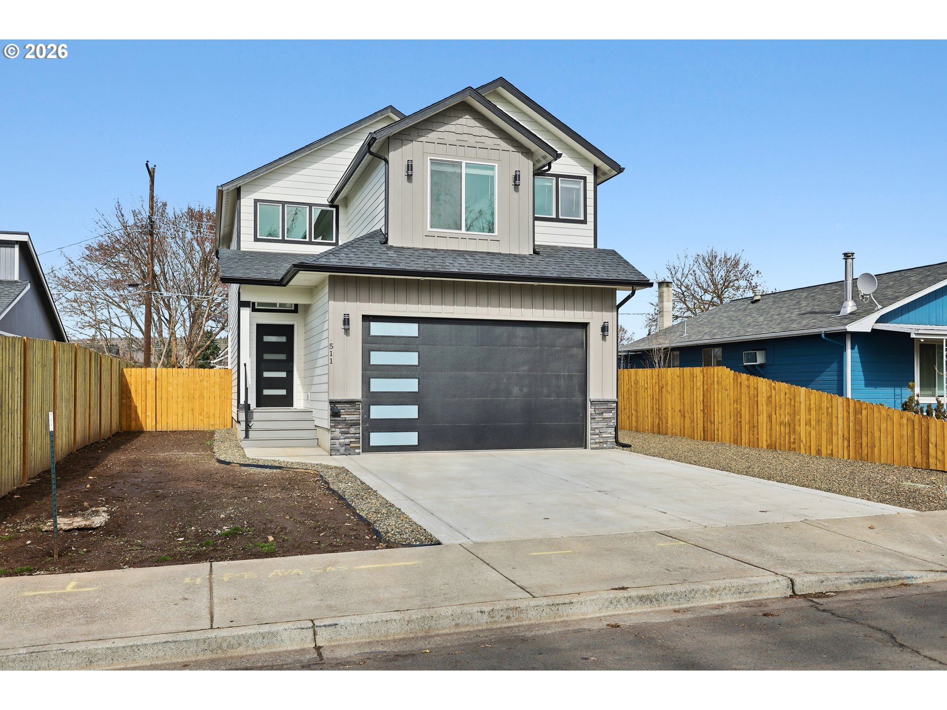 511 East Collins Street Goldendale, WA 98620 - Photo 40 of 41 a front view of a house with a yard and garage