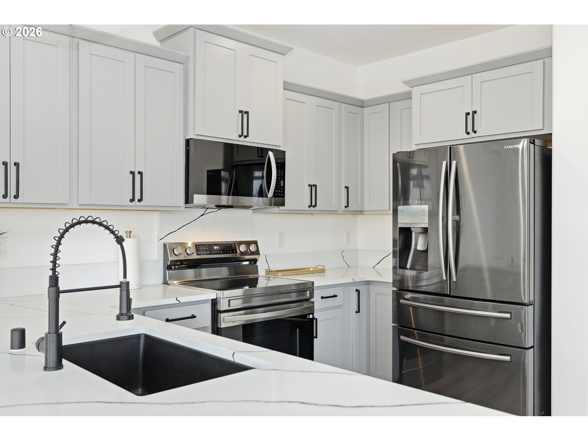 511 East Collins Street Goldendale, WA 98620 - Photo 9 of 41 a kitchen with granite countertop a refrigerator and a sink