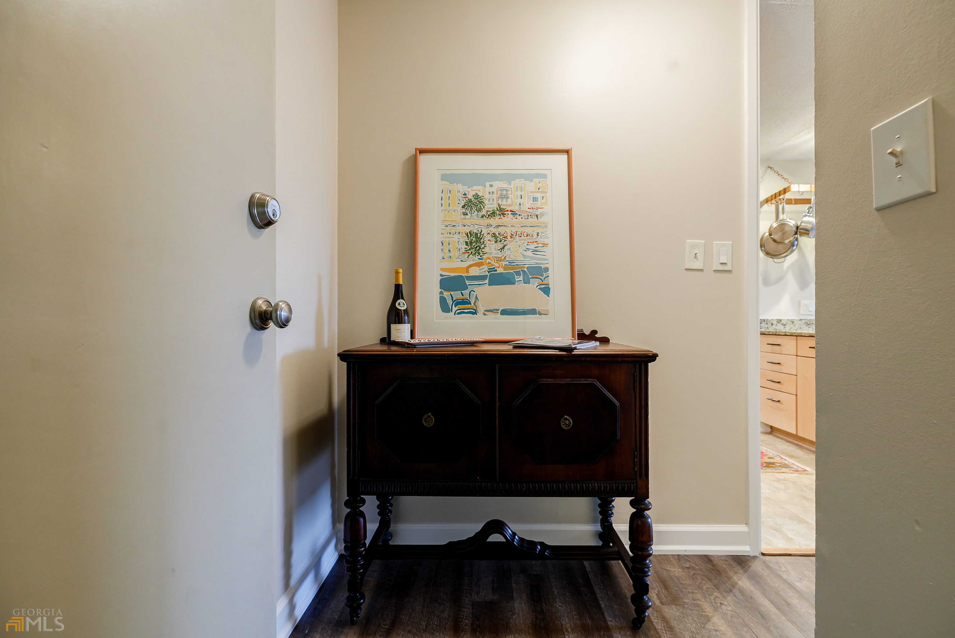 2285 Peachtree Road, Unit 509 Atlanta, GA 30309 - Photo 1 of 1 a view of a workspace room with furniture and wooden floor