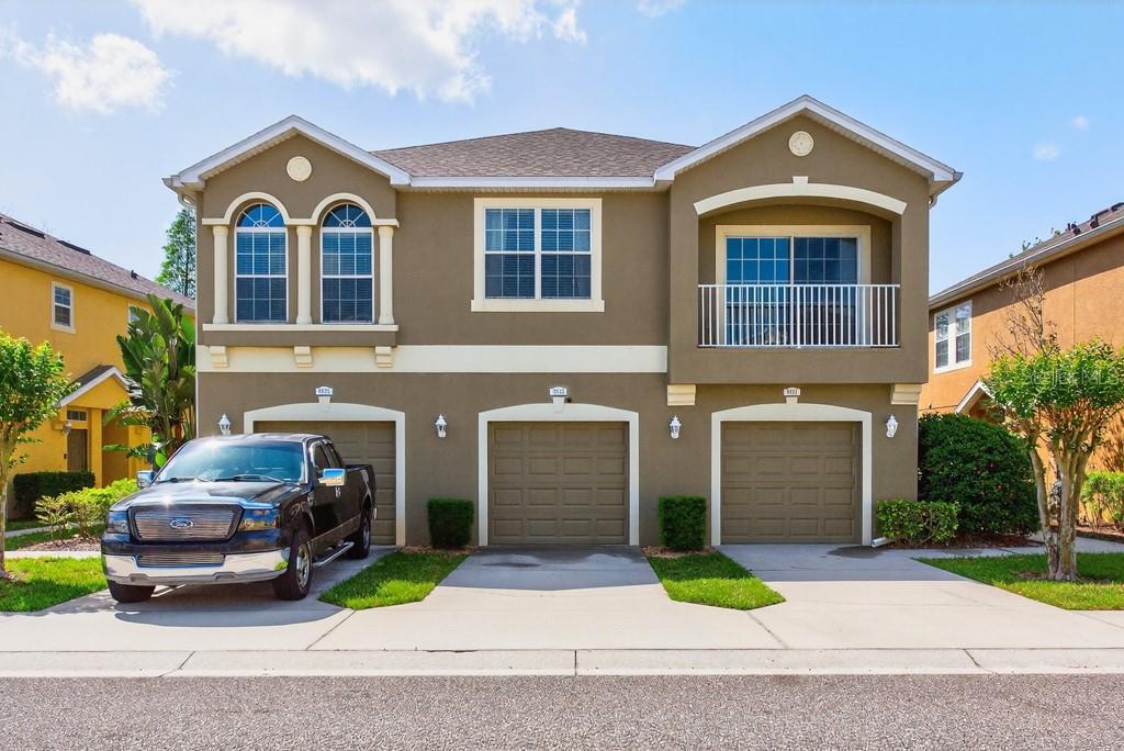 8831 Moonlit Meadows Loop Riverview, FL 33578 - Photo 1 of 1 a front view of a house with a yard and garage
