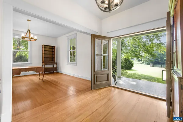 a kitchen with granite countertop a window sink and cabinets