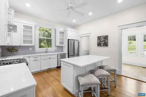 a view of entryway with wooden floor and stairs