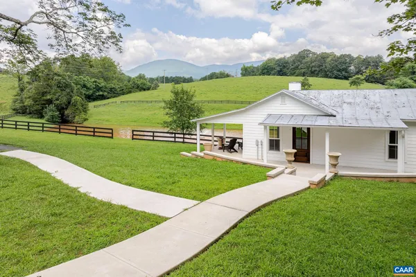 a view of a lake with a yard