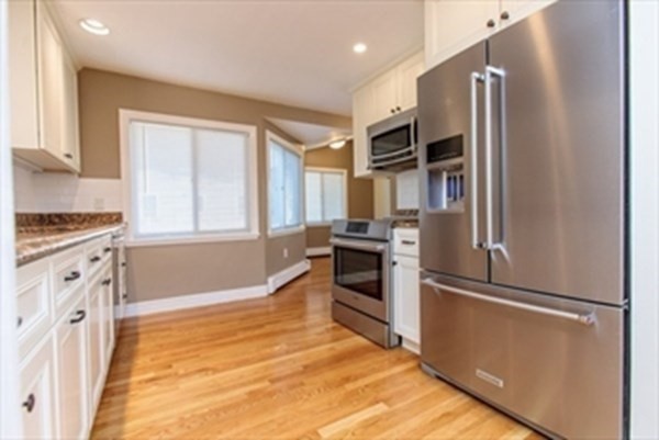82 Beechwood Road Wellesley, MA 02482 - Photo 12 of 25 a kitchen with cabinets and stainless steel appliances