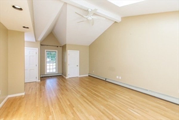 82 Beechwood Road Wellesley, MA 02482 - Photo 18 of 25 a view of an empty room with wooden floor and a window