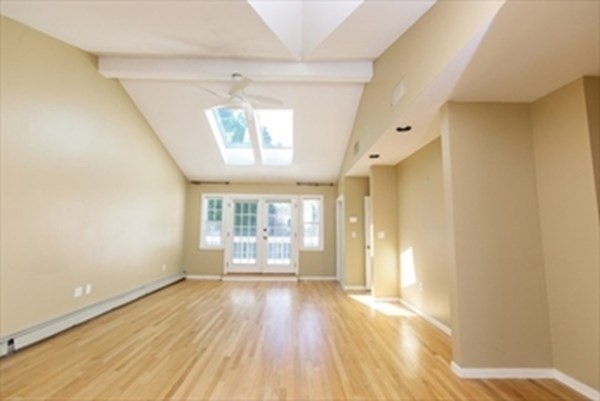 82 Beechwood Road Wellesley, MA 02482 - Photo 19 of 25 wooden floor in an empty room with a window
