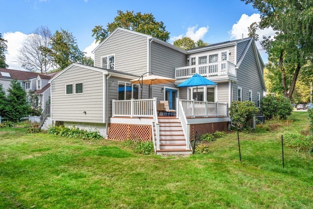82 Beechwood Road Wellesley, MA 02482 - Photo 24 of 25 a front view of a house with a garden