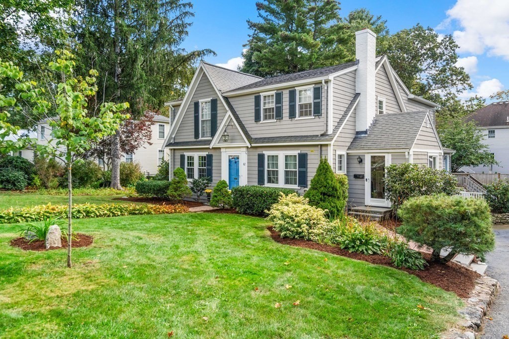82 Beechwood Road Wellesley, MA 02482 - Photo 4 of 25 a front view of a house with a yard