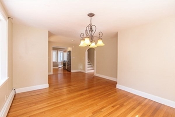 82 Beechwood Road Wellesley, MA 02482 - Photo 7 of 25 a view of a room with wooden floor and chandelier