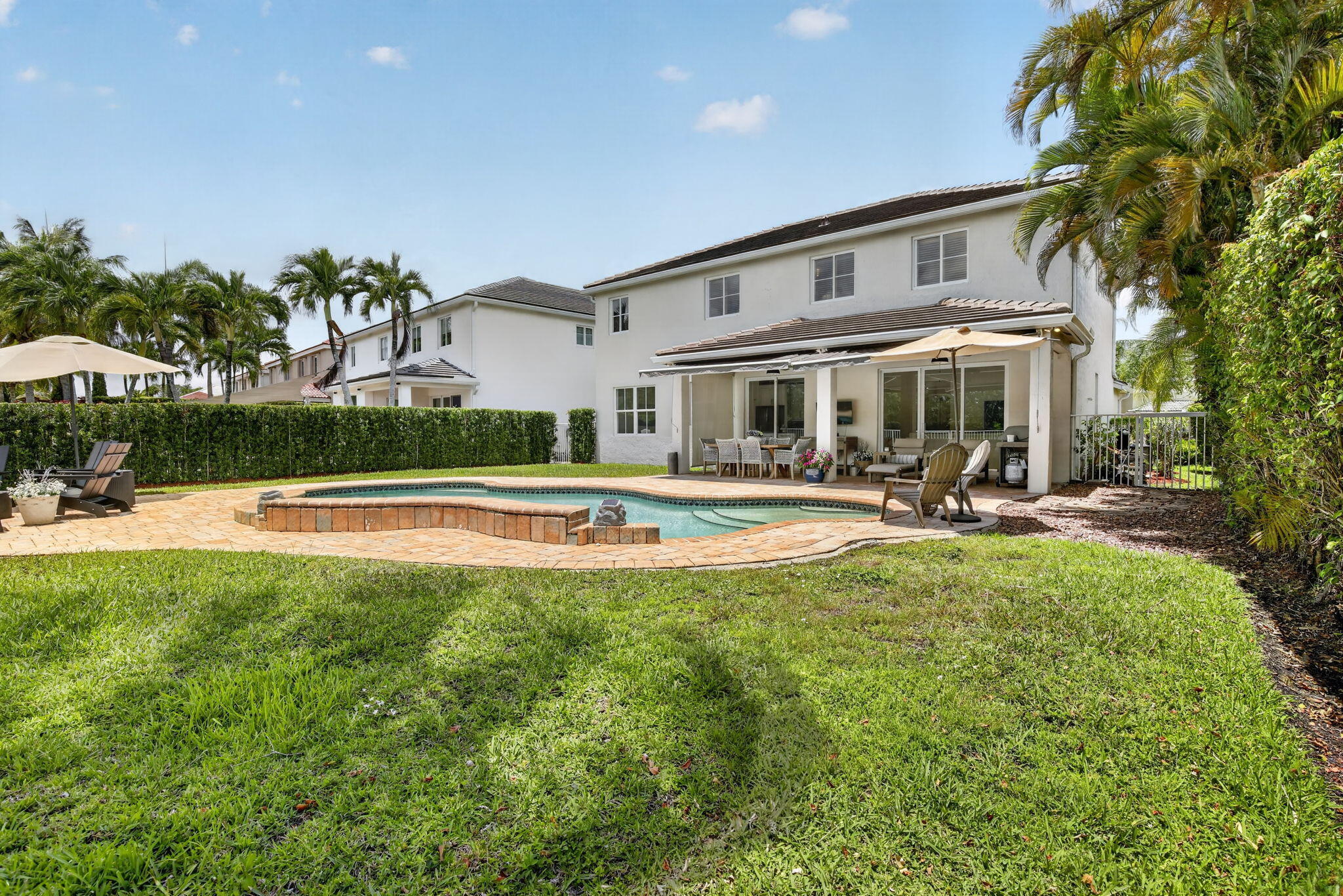 4299 Laurel Ridge Circle Weston, FL 33331 - Photo 9 of 103 a swimming pool view with a outdoor seating