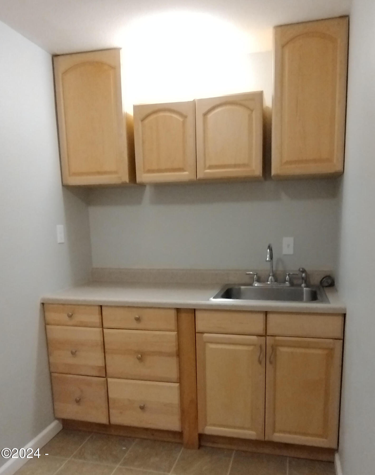 630 Southwest Fall Street Newport, OR 97365 - Photo 24 of 28 Utility Room With Sink and Storage