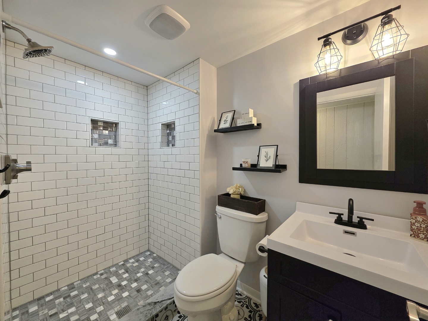574 Aberdeen Road Frankfort, IL 60423 - Photo 16 of 37 a bathroom with a toilet a sink a mirror and vanity