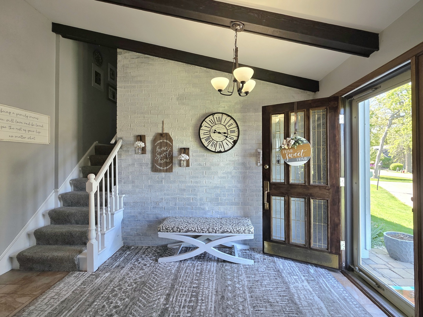 574 Aberdeen Road Frankfort, IL 60423 - Photo 19 of 37 a view of a hallway with entryway wooden floor and front door