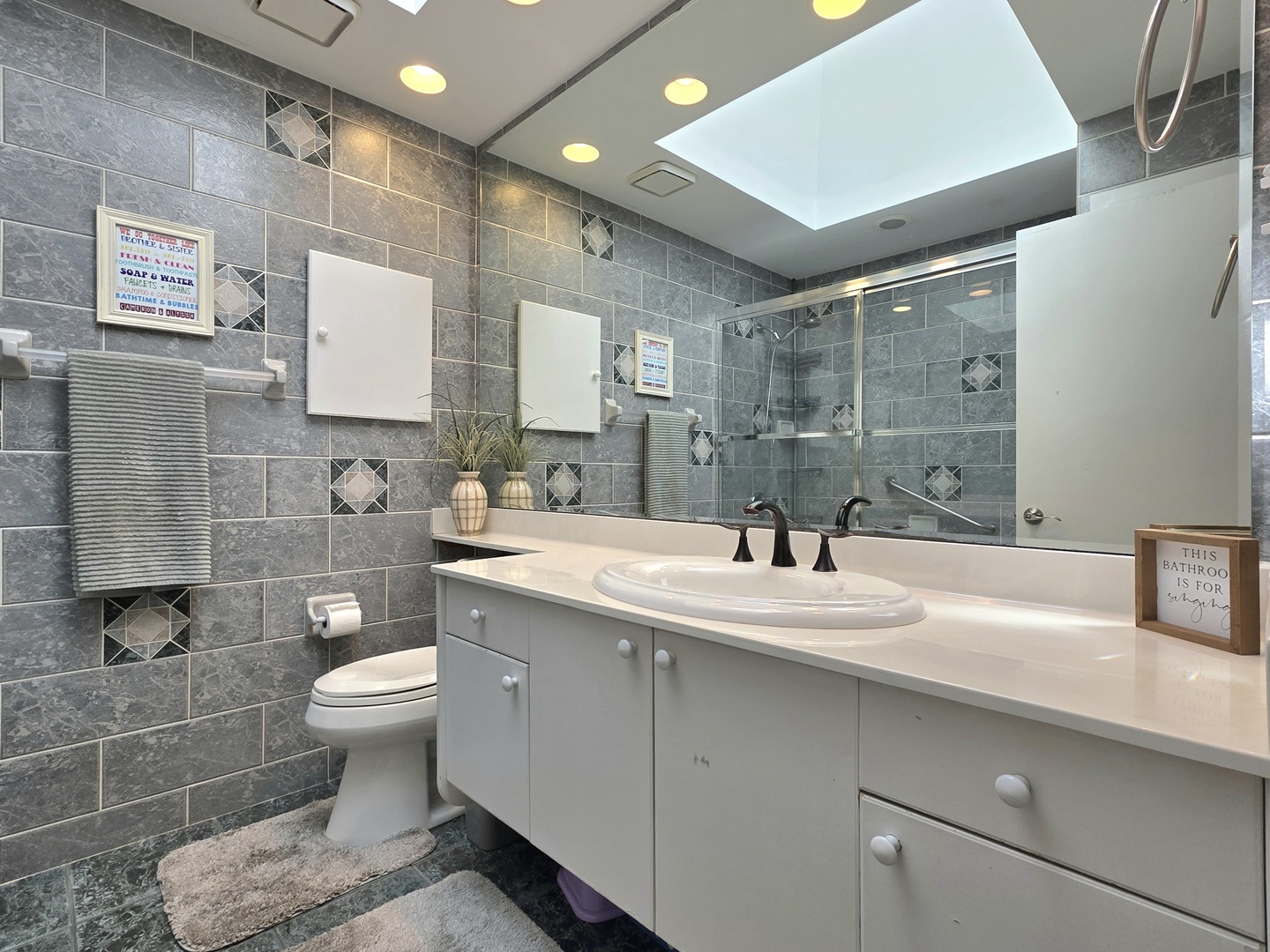 574 Aberdeen Road Frankfort, IL 60423 - Photo 27 of 37 a bathroom with a sink toilet a mirror and shower