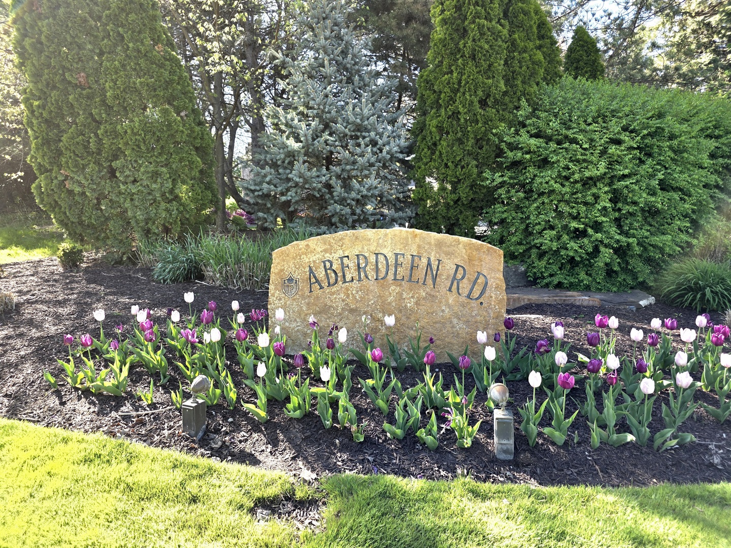 574 Aberdeen Road Frankfort, IL 60423 - Photo 37 of 37 a sign that is in front of flowers